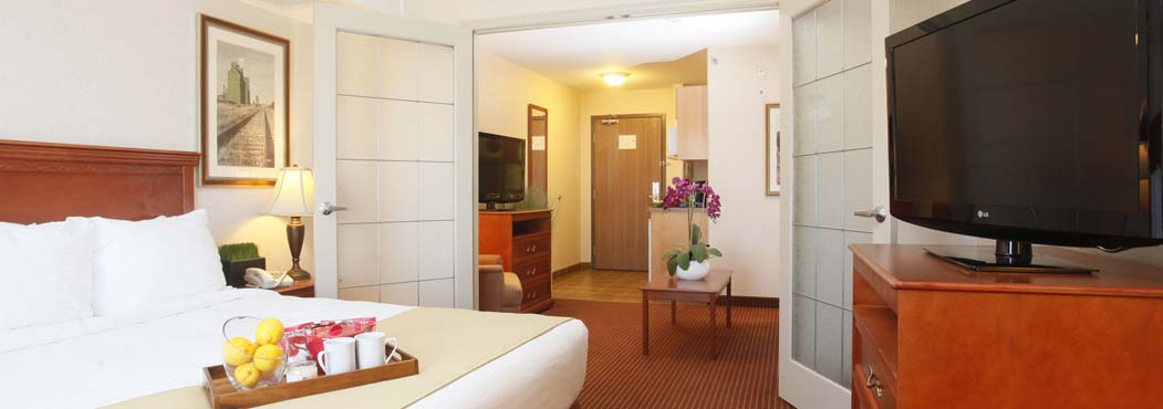 Stonebridge Dawson Creek rooms with white swinging doors to the bedroom
